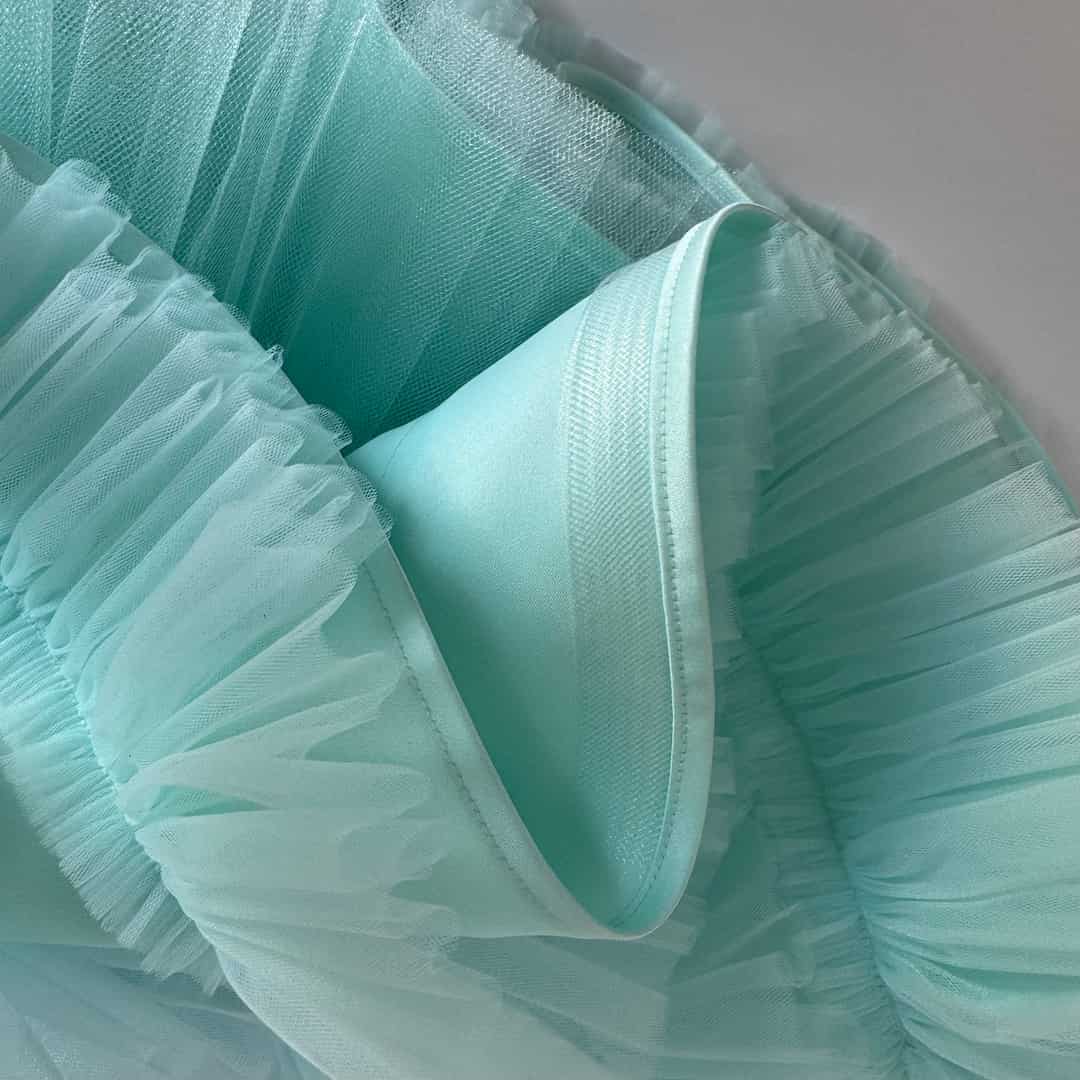 Fine crinoline used in tulle dress skirt for gentle structure and elegant shape