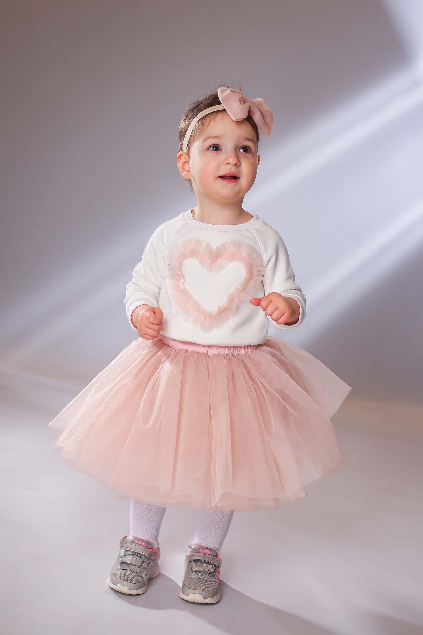 Girl wearing blush pink tulle skirt with sweatshirt – elegant tutu skirt for toddlers