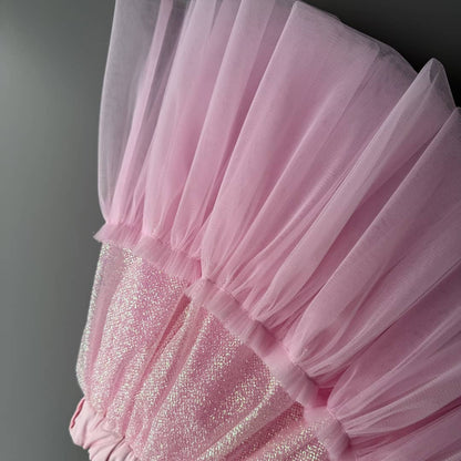Close-up detail of pink glitter tulle skirt fabric for girls with soft sparkling layers