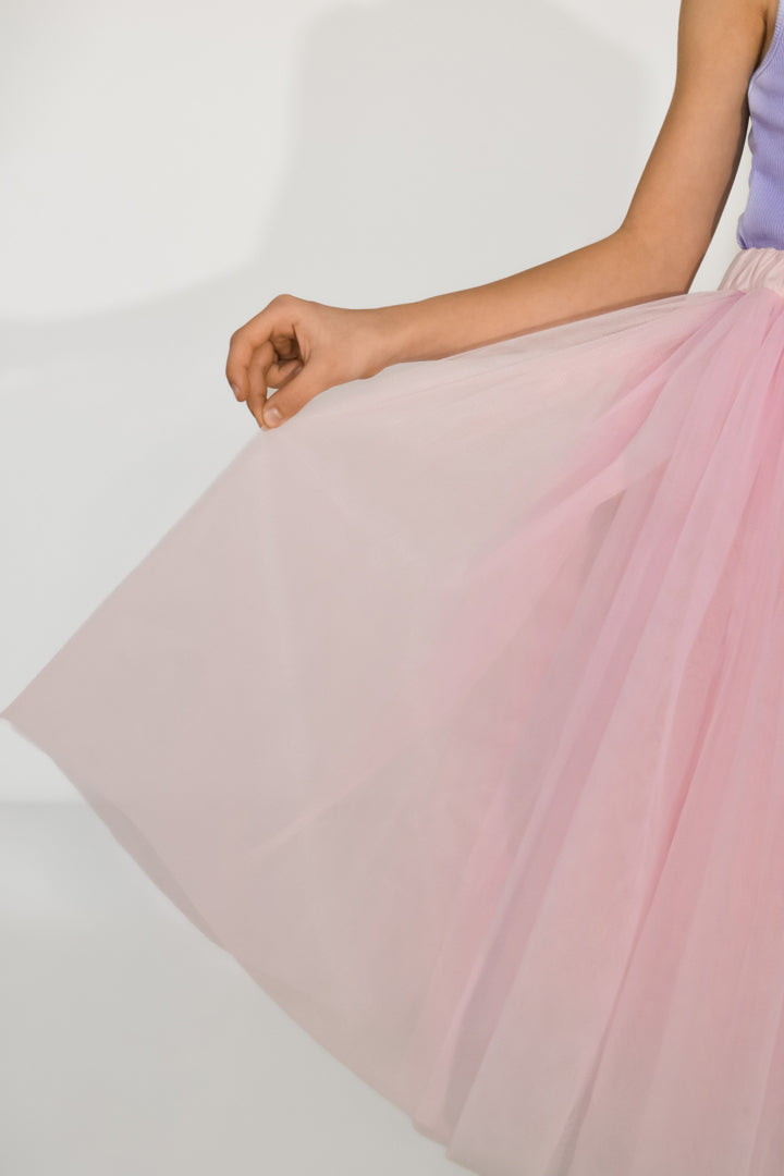 Close-up detail of pink tulle skirt for girls – soft layered fabric with elegant handmade texture