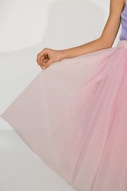 Close-up detail of pink tulle skirt for girls – soft layered fabric with elegant handmade texture