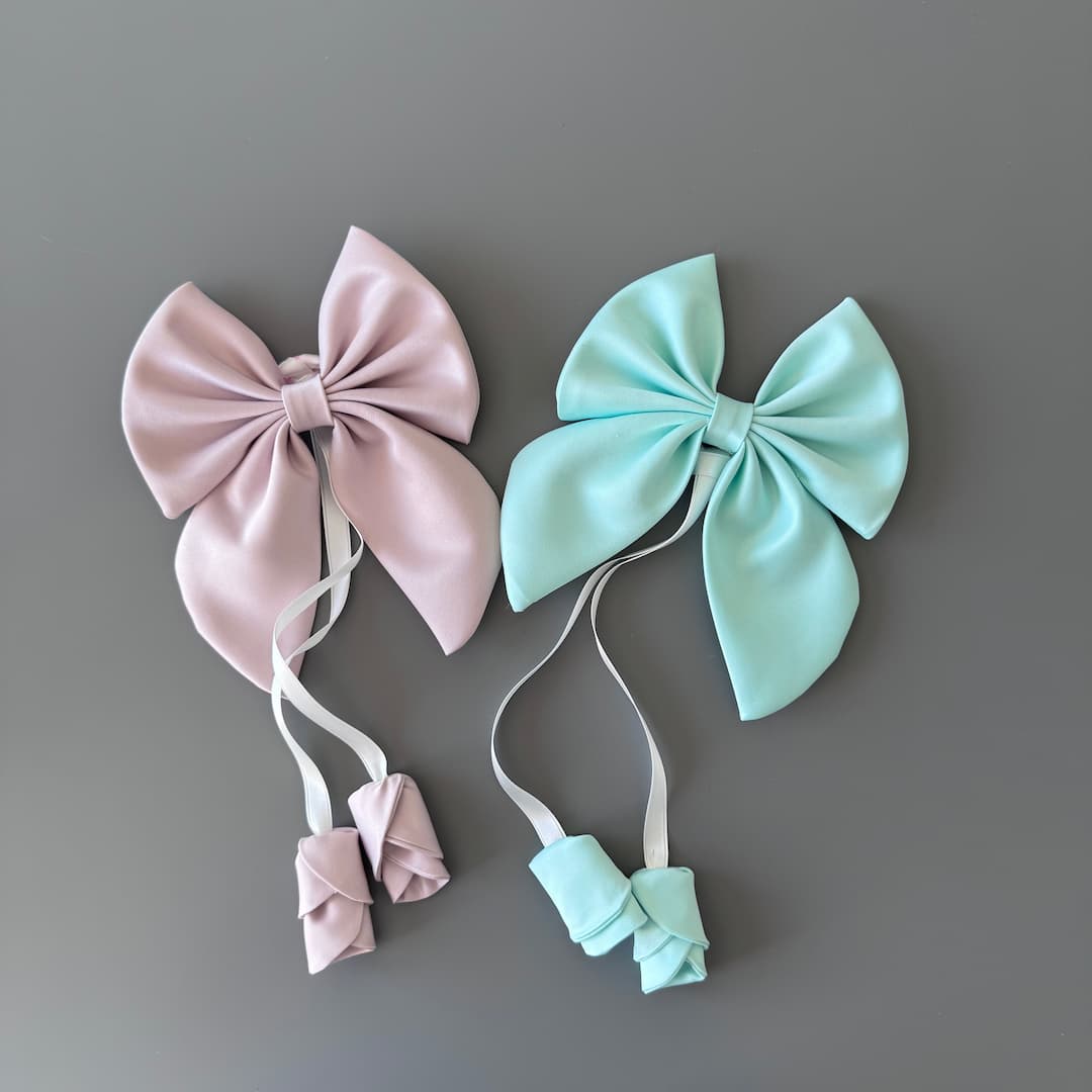 Powder pink and mint handmade satin hair bows with floral ribbon detail