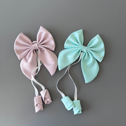 Powder pink and mint handmade satin hair bows with floral ribbon detail