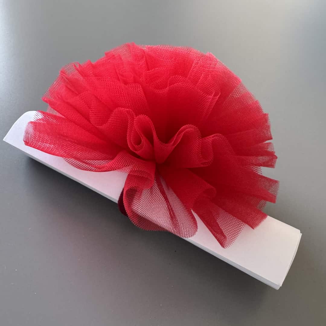 Red tulle pom pom hair tie for girls, handmade hair accessory for children and festive occasions